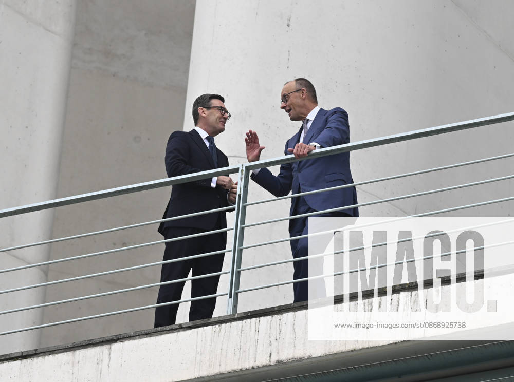 British Prime Minister Burnham welcomed with military ceremony in Berlin BERLIN, GERMANY - OCTOBER 8: German Chancellor Friedrich Merz (R) and British Prime Minister Andy Burnham (L) chat on the balcony of the Federal Chancellery following a military welcoming ceremony held for Burnham in Berlin, Germany, on October 8, 2026. Halil Sagirkaya Anadolu Berlin Germany. Editorial use only. Please get in touch for any other usage.