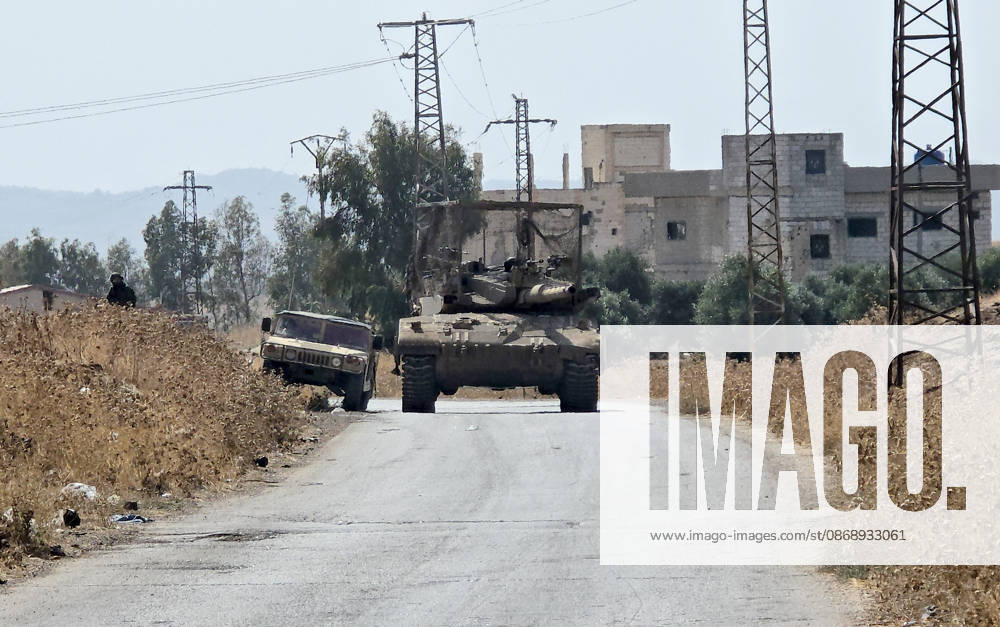 Israeli army conducts raids in Syria s Quneitra countryside QUNEITRA, SYRIA - OCTOBER 8: Israeli forces patrol the village with tanks as they conduct raids in residential areas and fire harassment shots at open areas in the countryside of Quneitra, southern Syria, on October 8, 2026. Huseyin Mesal Anadolu Quneitra Syria. Editorial use only. Please get in touch for any other usage.