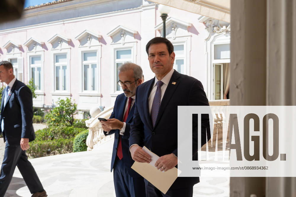 U.S. Secretary of State MARCO RUBIO, right, and Portugal s Minister of State and Foreign Affairs PAULO RANGEL enter their joint press conference at Palacio das Necessidades in Lisbon, Portugal, on October 8, 2026. RUBIO carries papers while RANGEL checks a mobile phone as they arrive for the joint media appearance during RUBIO s visit to Portugal. Lisbon Portugal - ZUMAr238 20261008_zip_r238_004