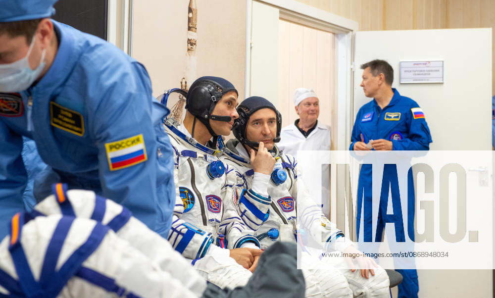 Baikonur, Kazakhstan. 14 July, 2026. NASA astronaut Anil Menon, left, and Roscosmos cosmonaut Pyotr Dubrov talk during Sokol suit pressure checks at the Baikonur Cosmodrome, July 14, 2026 in Baikonur, Kazakhstan. The crew launched to the International Space Station later that day. Baikonur Kazakhstan - ZUMAp138 20261008_zaa_p138_011