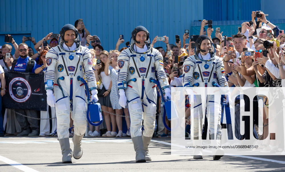 Baikonur, Kazakhstan. 14 July, 2026. NASA astronaut Anil Menon, left, and Roscosmos cosmonauts Pyotr Dubrov and Anna Kikina depart Building 254 for their Soyuz launch at the Baikonur Cosmodrome, July 14, 2026 in Baikonur, Kazakhstan. The crew launched to the International Space Station later that day. Baikonur Kazakhstan - ZUMAp138 20261008_zaa_p138_020