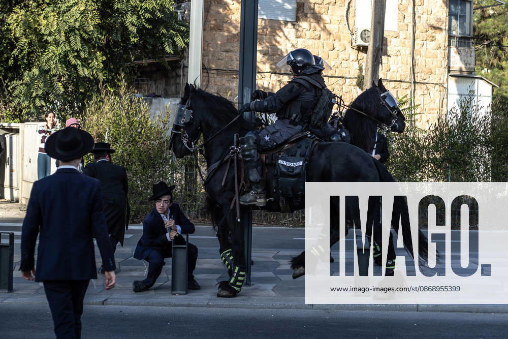 Anti-military service Ultra-Orthodox Jews block road to West Jerusalem JERUSALEM - OCTOBER 8: Mounted Israeli police officers on horseback deployed to the scene intervene against demonstrators as Ultra-Orthodox Jews, known as Haredi, protest the lack of legislation exempting yeshiva students from mandatory military service and the detention of students on grounds of draft evasion in West Jerusalem, Israel, on October 8, 2026. Haredi protesters lie on the road leading to West Jerusalem and block traffic. Mostafa Alkharouf Anadolu Jerusalem Israel. Editorial use only. Please get in touch for any other usage.