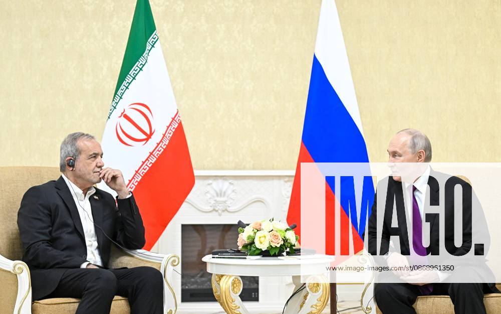 Turkmenistan Russia 9260799 08.10.2026 Iranian President Masoud Pezeshkian and Russian President Vladimir Putin attend a meeting in Turkmenbashi, Turkmenistan. Sergey Bobylev Sputnik Turkmenbashi Turkmenistan