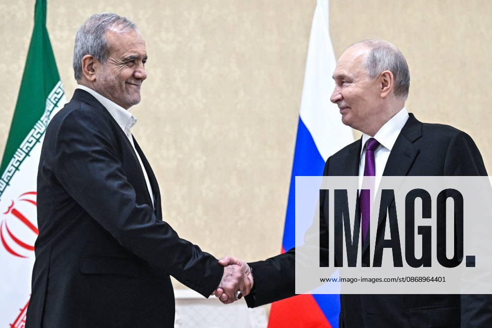TURKMENISTAN, BALKAN PROVINCE - OCTOBER 8, 2026: Masoud Pezeshkian (L), President of Iran, and his counterpart Vladimir Putin of Russia shake hands during a bilateral meeting in Turkmenbasy Turkmenistan - ZUMAt113 20261008_zaa_t113_740