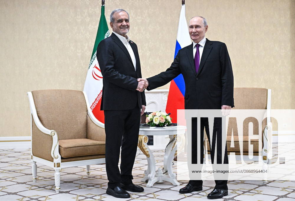 TURKMENISTAN, BALKAN PROVINCE - OCTOBER 8, 2026: Masoud Pezeshkian (L), President of Iran, and his counterpart Vladimir Putin of Russia shake hands during a bilateral meeting in Turkmenbasy Turkmenistan - ZUMAt113 20261008_zaa_t113_741