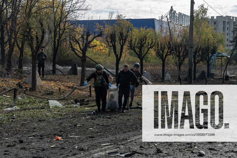 Russian Strike Hits Kramatorsk Buses Emergency workers carry the fully covered body of a person killed in a Russian strike across blast-damaged ground in Kramatorsk, Donetsk region, Ukraine, on October 8, 2026. Ukrainian authorities said a Russian guided bomb struck two scheduled passenger buses in Kramatorsk at about 10:00. At least 30 people were killed and at least 18 wounded, while Ukraine s State Emergency Service later reported 33 deaths; public transport in Kramatorsk and nearby Sloviansk was suspended after the attack. Kramatorsk Donetsk Ukraine