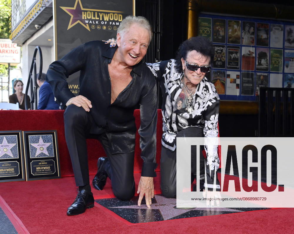 Graham Russell (L) and Russell Hitchcock of the rock duo Air Supply kneel next to their star during an unveiling ceremony honoring them with the 2,859th star on the Hollywood Walk of Fame in Los Angeles on Thursday October 8, 2026. LAP2026100810 JIMxRUYMEN