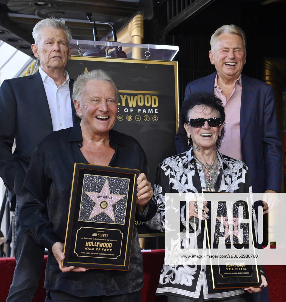 Graham Russel (L) and Russell Hitchcock of the rock duo Air Supply hold replica plaques during during an unveiling ceremony honoring them with the 2,859th star on the Hollywood Walk of Fame in Los Angeles on Thursday October 8, 2026. Looking on is David Foster (L) and Pat Sajak LAP2026100804 JIMxRUYMEN