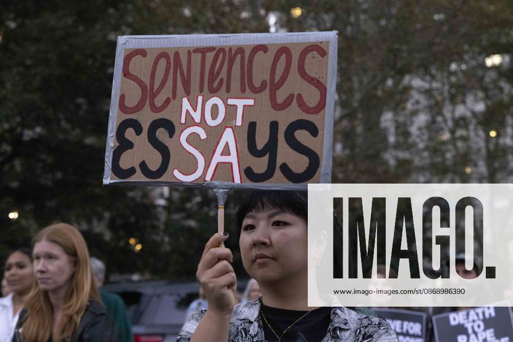 A demonstrator holds a sign that reads Sentences NOT Essays joining hundreds at a rally in Foley Square outside the New York State Supreme Court building in Lower Manhattan under the banner . StopSexualViolence: From the Frat House to the White House. The protest is one of many rallies and campus walkouts around the country demanding justice for Cornell s Jane Doe. New York USA - ZUMAr174 20261008_znp_r174_008
