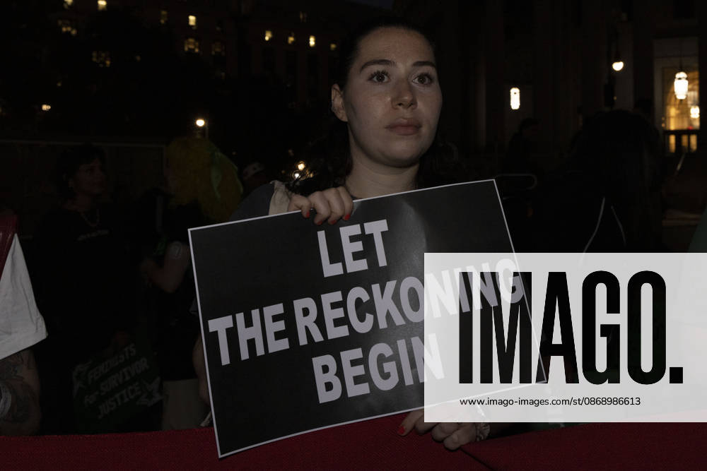 A demonstrator holds a sign that reads LET THE RECKONING BEGIN joining hundreds at a rally in Foley Square outside the New York State Supreme Court building in Lower Manhattan under the banner . StopSexualViolence: From the Frat House to the White House. The protest is one of many rallies and campus walkouts around the country demanding justice for Cornell s Jane Doe. New York USA - ZUMAr174 20261008_znp_r174_009