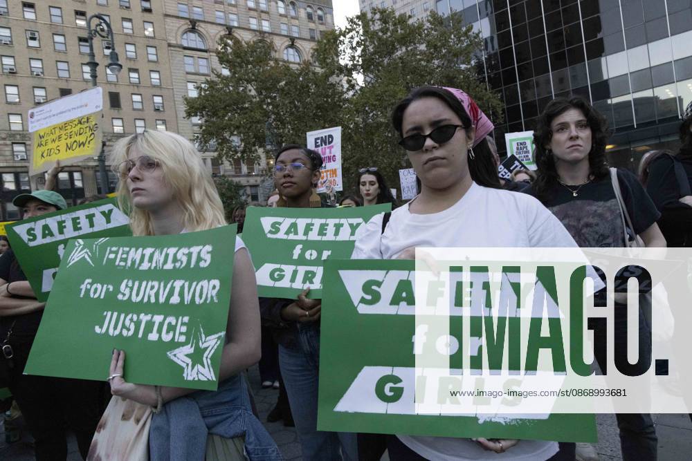 Demonstrators hold signs that read SAFETY for GIRLS FEMINISTS for SURVIVOR JUSTICE joining hundreds at a rally in Foley Square outside the New York State Supreme Court building in Lower Manhattan under the banner . StopSexualViolence: From the Frat House to the White House. The protest is one of many rallies and campus walkouts around the country demanding justice for Cornell s Jane Doe. New York USA - ZUMAr174 20261008_znp_r174_037