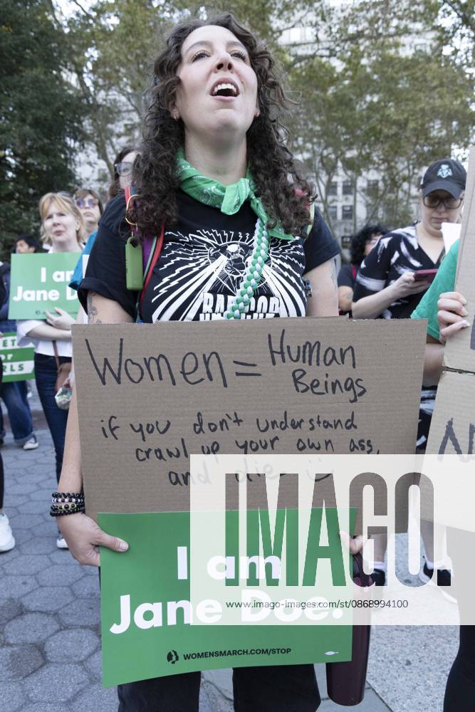 A demonstrator holds signs that read Women equal Human Beings if you don t understand crawl up your own ass. and die I am Jane Doe. joining hundreds at a rally in Foley Square outside the New York State Supreme Court building in Lower Manhattan under the banner . StopSexualViolence: From the Frat House to the White House. The protest is one of many rallies and campus walkouts around the country demanding justice for Cornell s Jane Doe. New York USA - ZUMAr174 20261008_znp_r174_023