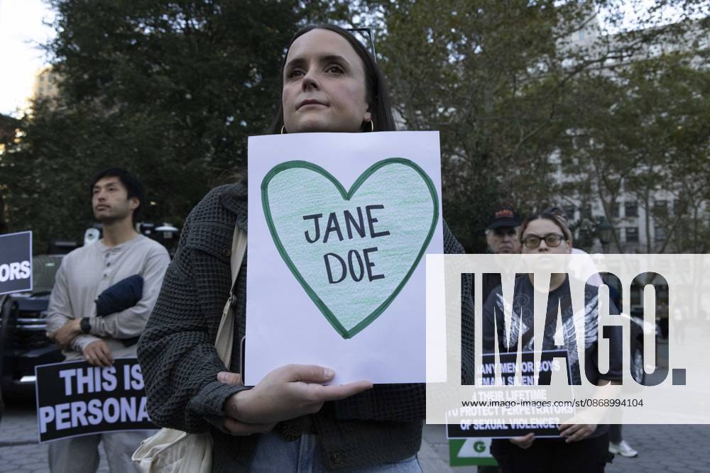 A demonstrator holds a sign that reads JANE DOE inside a green heart joining hundreds at a rally in Foley Square outside the New York State Supreme Court building in Lower Manhattan under the banner . StopSexualViolence: From the Frat House to the White House. The protest is one of many rallies and campus walkouts around the country demanding justice for Cornell s Jane Doe. New York USA - ZUMAr174 20261008_znp_r174_024