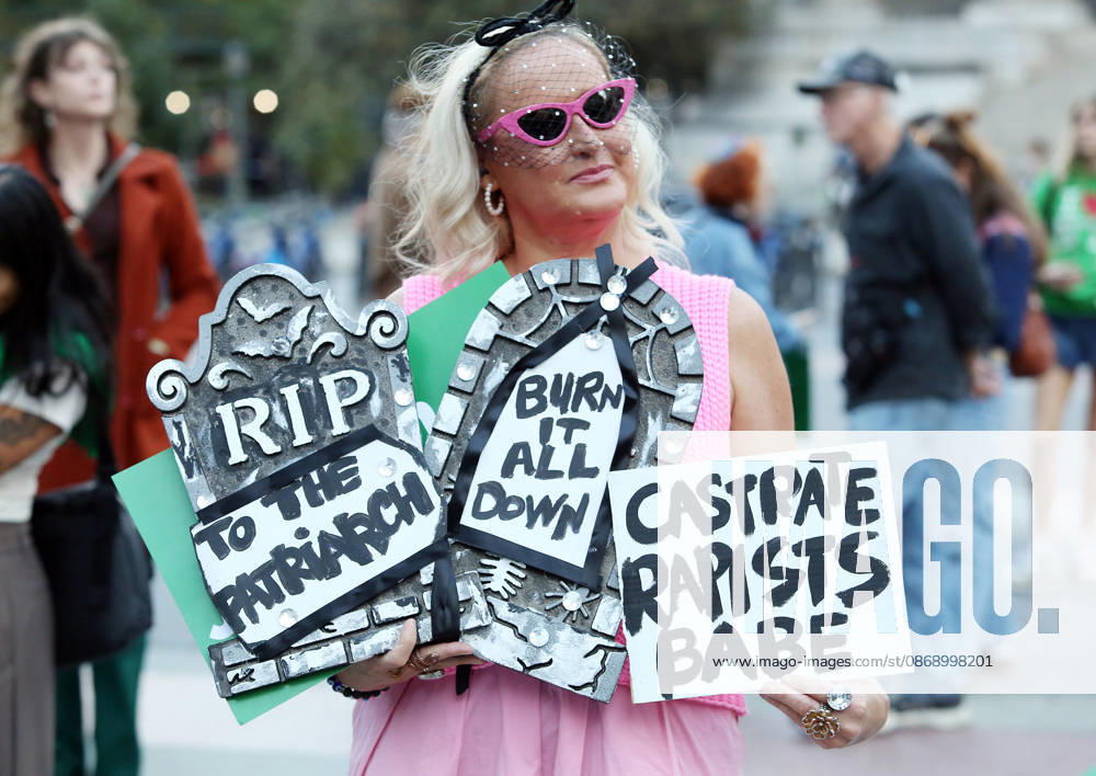 A woman holds signs that say, RIP to the Patriarch , Burn it all down , and Castrate Rapists Babe . A demonstration of several hundred people, mostly women, showed support for Cornell student Jane Doe , who sued after a 2024 gang rape. The protestors gathered at Foley Square and called for tougher action against sexual violence. New York City USA - ZUMAk45_ 20261008_zaf_k45_013