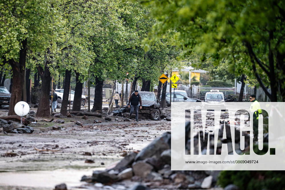 Consequences of a mudslide that affected the area from San Carlos de Apoquindo to Los Dominicos in the Las Condes district, causing widespread damage and sweeping away vehicles and people. Diego Martin Aton, Chile, Aton 1198089 jpeg