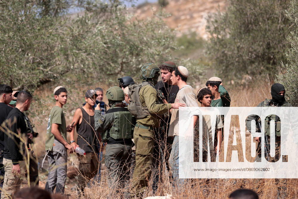 Clashes erupt between Israeli settlers and Palestinian farmers in West Bank RAMALLAH, WEST BANK - OCTOBER 9: Clashes break out between Israeli settlers, accompanied by Israeli soldiers, and Palestinian farmers harvesting olives in the town of Deir Ibzi, near Ramallah in West Bank, on October 9, 2026. The incident reportedly involved damage to olive crops and provocative actions by the settlers. Issam Rimawi Anadolu Ramallah West Bank. Editorial use only. Please get in touch for any other usage.
