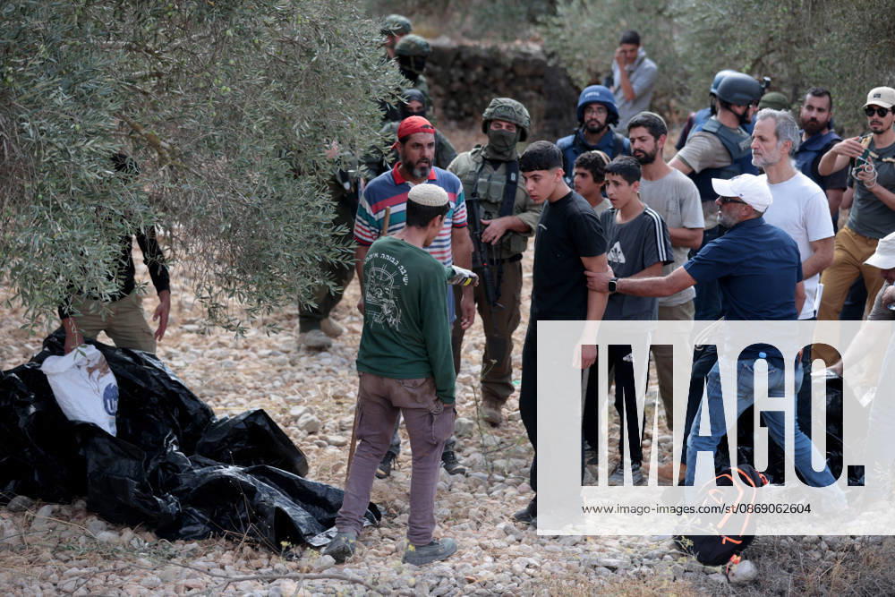 Clashes erupt between Israeli settlers and Palestinian farmers in West Bank RAMALLAH, WEST BANK - OCTOBER 9: Clashes break out between Israeli settlers, accompanied by Israeli soldiers, and Palestinian farmers harvesting olives in the town of Deir Ibzi, near Ramallah in West Bank, on October 9, 2026. The incident reportedly involved damage to olive crops and provocative actions by the settlers. Issam Rimawi Anadolu Ramallah West Bank. Editorial use only. Please get in touch for any other usage.