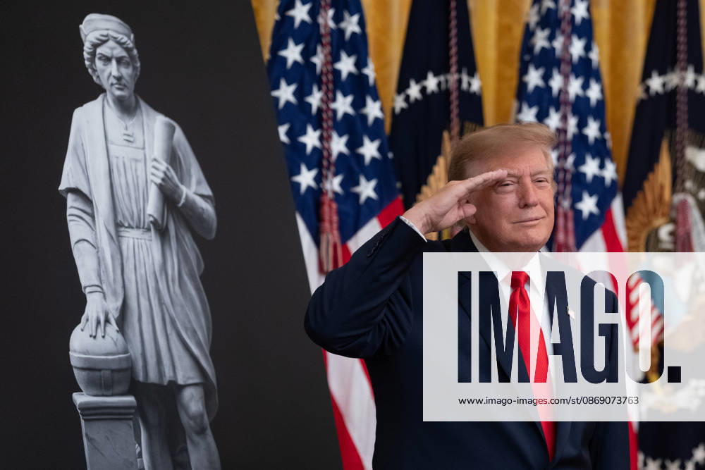 President Donald Trump salutes during the National Anthem during an event in the East Room of the White House in Washington, DC on Friday, Oct. 9, 2026. Trump is hosting a Columbus Day celebration. WASP20261009113 AaronxSchwartz