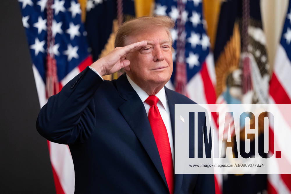 President Donald Trump salutes during the National Anthem during an event in the East Room of the White House in Washington, DC on Friday, Oct. 9, 2026. Trump is hosting a Columbus Day celebration. WASP20261009132 AaronxSchwartz