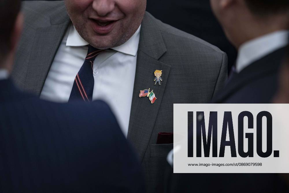 An unidentified guest wears a Trump lapel pin as United States President Donald J Trump hosts a Columbus Day Celebration in the East Room of the White House in Washington, DC, USA on Friday, October 8, 2026 Washington USA - ZUMAs152 20261009_faa_s152_019