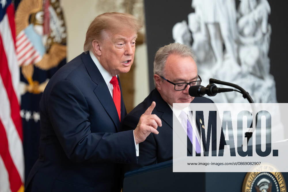 Brett Rugo, founder of Rugo Stone which constructed a helipad on the South Lawn, looks on as United States President Donald J Trump makes remarks during a Columbus Day Celebration in the East Room of the White House in Washington, DC, USA on Friday