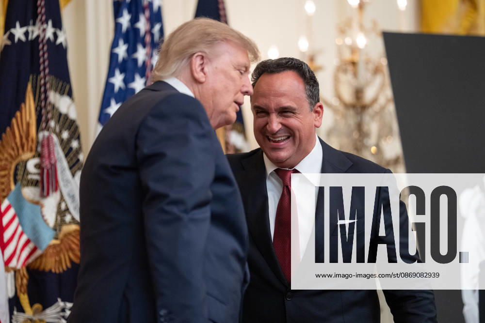 United States President Donald J Trump with singer Christopher Macchio as he hosts a Columbus Day Celebration in the East Room of the White House in Washington, DC, USA on Friday