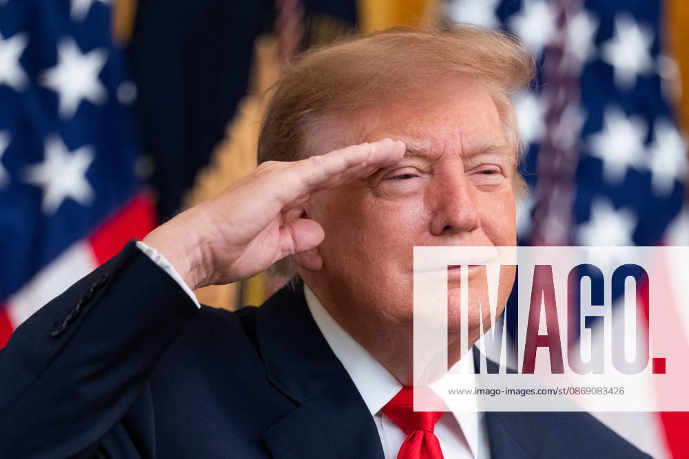 United States President Donald J Trump salutes during the national anthem as he hosts a Columbus Day Celebration in the East Room of the White House in Washington, DC, USA on Friday, October 8, 2026 Washington USA - ZUMAs152 20261009_faa_s152_037