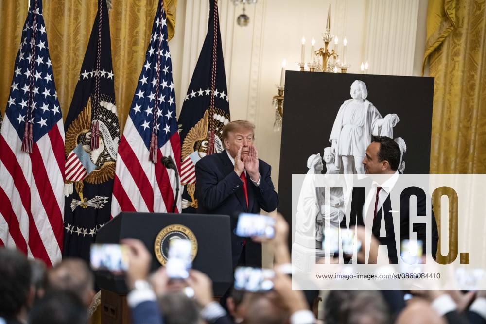 United States President Donald J Trump greets singer Christopher Macchio as he hosts a Columbus Day Celebration in the East Room of the White House in Washington, DC, USA on Friday