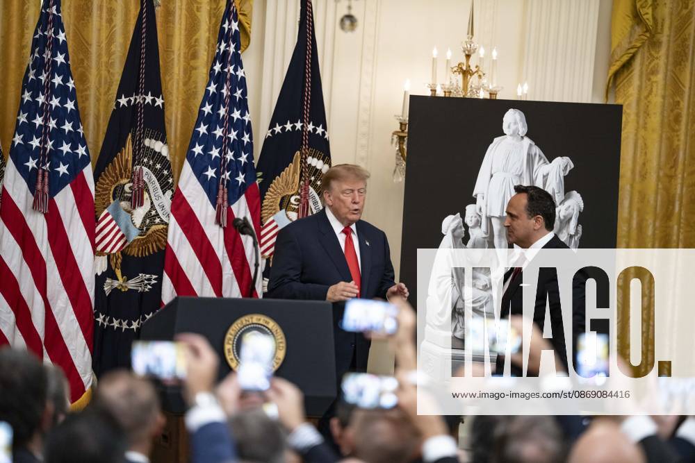 United States President Donald J Trump greets singer Christopher Macchio as he hosts a Columbus Day Celebration in the East Room of the White House in Washington, DC, USA on Friday