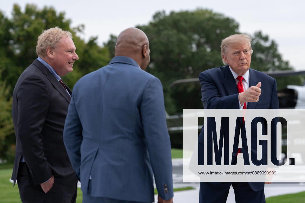 President Donald Trump gives a thumbs up as he and president of the New York yankees Randy Levine and former professional boxer Mike Tyson walk on the South Lawn of the White House before boarding Marine One in Washington, DC on Friday, Oct. 9, 2026. Trump is heading to Syracuse on Friday to boost Republican gubernatorial candidate Bruce Blakeman, who is trailing Governor Kathy Hochul in polls ahead of November s election. WASP20261009158 AaronxSchwartz