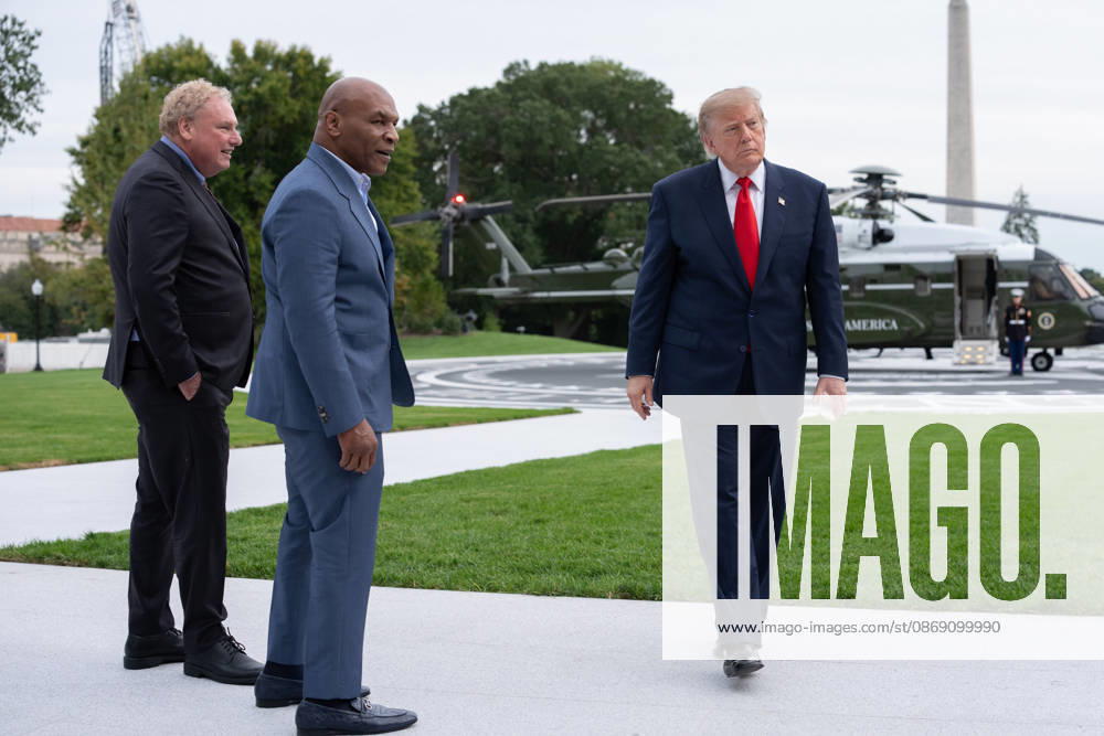 President Donald Trump walks with former professional boxer Mike Tyson and owner of the New York Yankees Randy Levine on the South Lawn of the White House before boarding Marine One in Washington, DC on Friday, Oct. 9, 2026. President Donald Trump is heading to Syracuse on Friday to boost Republican gubernatorial candidate Bruce Blakeman, who is trailing Governor Kathy Hochul in polls ahead of November s election. WASP20261009160 AaronxSchwartz