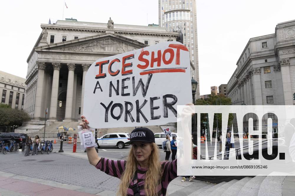 A demonstrator holds a sign that reads ICE SHOT A NEW YORKER. Thousands of people join the Hands Off NYC coalition at a rally outside Federal Plaza in Lower Manhattan before marching through the streets for an emergency protest demanding justice the day following ICE shooting a Bronx man while his 5 year child was in the car. New York USA - ZUMAr174 20261009_znp_r174_011