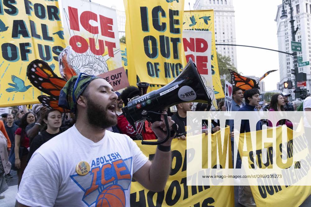 Demonstrators march through the streets of Lower Manhattan holding banners that read ICE OUT ICE OUT OF NYC STOP SHOOTING OUR NEIGHBORS at the Hands Off NYC coalition emergency protest demanding justice the day following ICE shooting a Bronx man while his 5 year child was in the car. New York USA - ZUMAr174 20261009_znp_r174_027