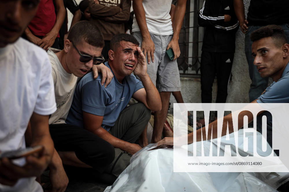 Israeli army continues attacks on Gaza despite ceasefire GAZA CITY, GAZA, PALESTINE - OCTOBER 10: Palestinians mourn after losing their loved ones in an Israeli attack on Gaza City, as Israeli army continues its attacks on the Gaza Strip despite the ceasefire, in Gaza City, Palestine, on October 10, 2026. The bodies of those killed in the attack were brought to Al-Shifa Hospital. Abdalhkem Abu Riash Anadolu Gaza City Gaza. Editorial use only. Please get in touch for any other usage.
