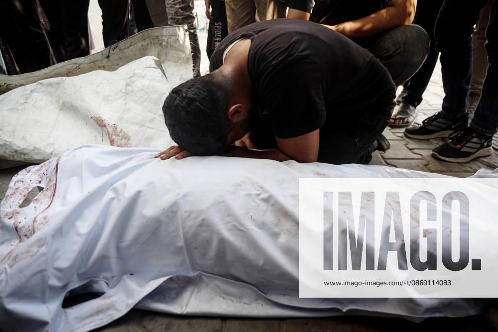 Israeli army continues attacks on Gaza despite ceasefire GAZA CITY, GAZA, PALESTINE - OCTOBER 10: Palestinians mourn after losing their loved ones in an Israeli attack on Gaza City, as Israeli army continues its attacks on the Gaza Strip despite the ceasefire, in Gaza City, Palestine, on October 10, 2026. The bodies of those killed in the attack were brought to Al-Shifa Hospital. Abdalhkem Abu Riash Anadolu Gaza City Gaza. Editorial use only. Please get in touch for any other usage.