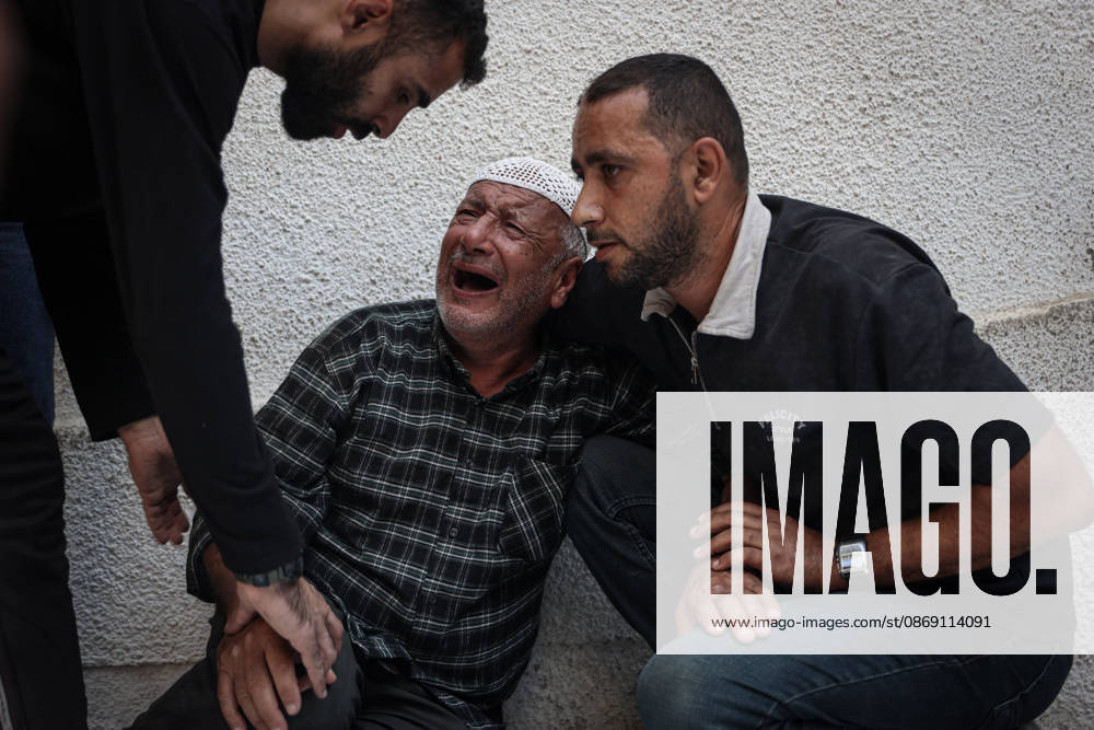 Israeli army continues attacks on Gaza despite ceasefire GAZA CITY, GAZA, PALESTINE - OCTOBER 10: Palestinians mourn after losing their loved ones in an Israeli attack on Gaza City, as Israeli army continues its attacks on the Gaza Strip despite the ceasefire, in Gaza City, Palestine, on October 10, 2026. The bodies of those killed in the attack were brought to Al-Shifa Hospital. Abdalhkem Abu Riash Anadolu Gaza City Gaza. Editorial use only. Please get in touch for any other usage.