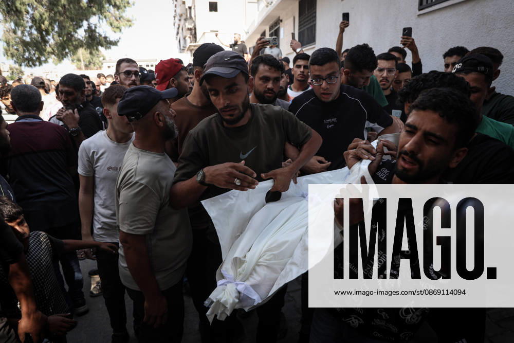 Israeli army continues attacks on Gaza despite ceasefire GAZA CITY, GAZA, PALESTINE - OCTOBER 10: Palestinians mourn after losing their loved ones in an Israeli attack on Gaza City, as Israeli army continues its attacks on the Gaza Strip despite the ceasefire, in Gaza City, Palestine, on October 10, 2026. The bodies of those killed in the attack were brought to Al-Shifa Hospital. Abdalhkem Abu Riash Anadolu Gaza City Gaza. Editorial use only. Please get in touch for any other usage.
