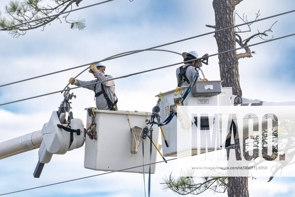 Crews work to repair power lines after a tree fell on them as Hurricane Isaias came ashore..Hurricane Isaias made landfall Friday, October 9 along the U.S. Gulf coast. Orange Beach USA - ZUMAs197 20261010_aaa_s197_002