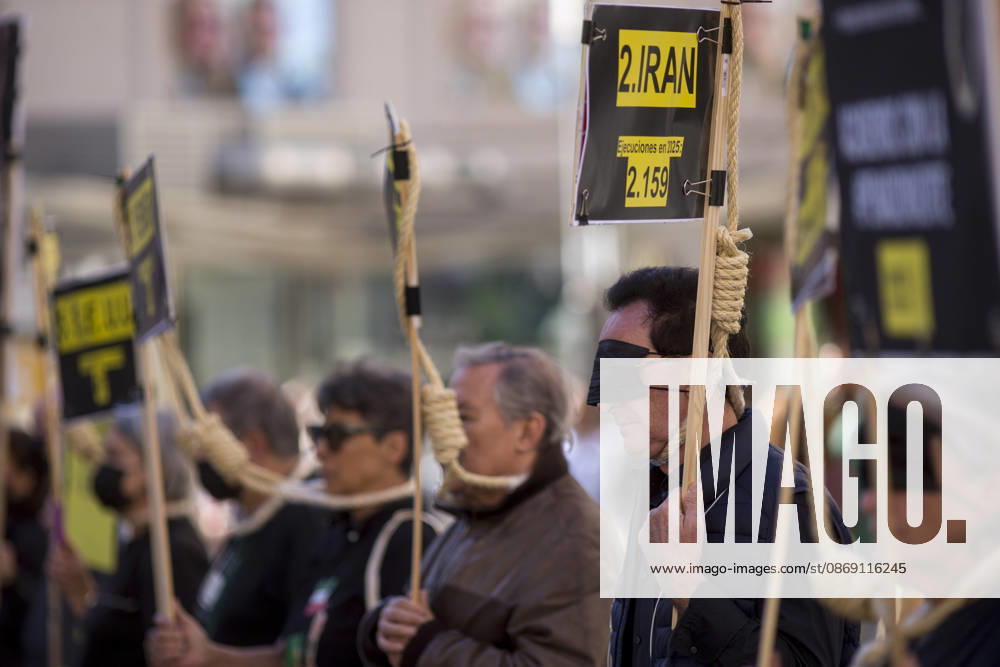 Protesters with signs and nooses around their necks during a rally at Callao Square in central Madrid. World Day Against the Death Penalty has been observed every October 10th since 2003. Madrid Spain - ZUMAs296 20261010_znp_s296_003