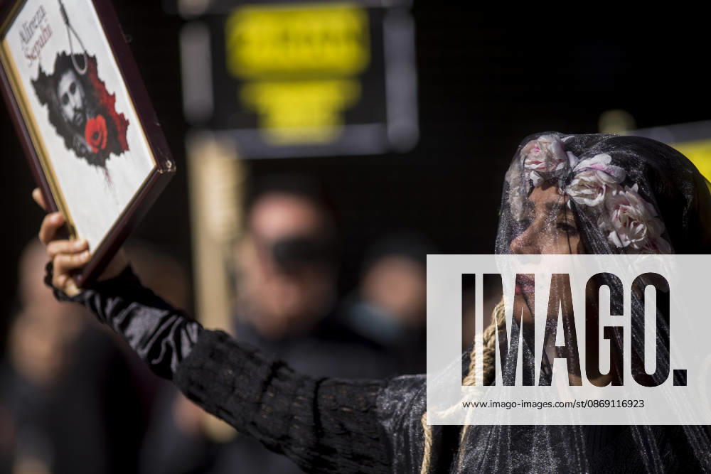 A woman holds a portrait, wearing a veil on her head during a rally against the death penalty in Callao Square in central Madrid. World Day Against the Death Penalty has been observed every October 10th since 2003. Madrid Spain - ZUMAs197 20261010_aaa_s197_025