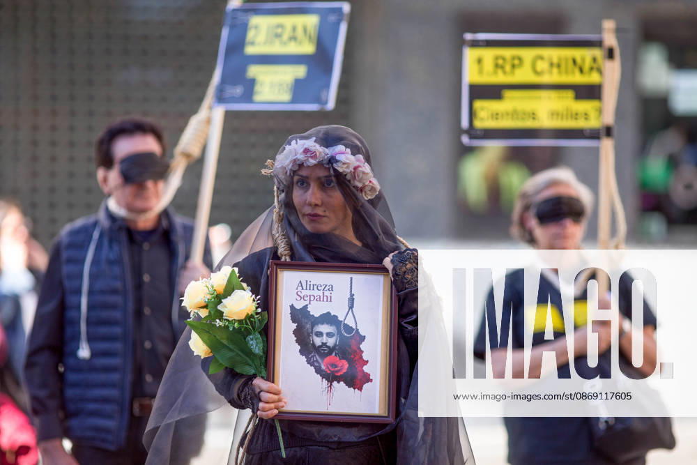A woman holds a portrait with a veil on her head, during a rally against the death penalty in Callao Square in central Madrid. World Day Against the Death Penalty has been observed every October 10th since 2003. Madrid Spain - ZUMAs197 20261010_aaa_s197_024