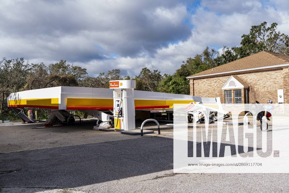 A child rides his bike past a Shell gas station that collapsed after Hurricane Isaias came ashore..Hurricane Isaias made landfall Friday, October 9 along the U.S. Gulf coast. Gulf Shores USA - ZUMAs197 20261010_aaa_s197_027