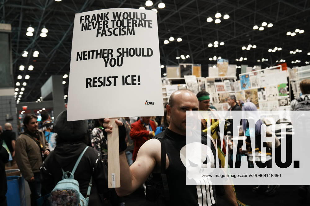 A fan of The Punisher holds an anti-fascism and anti-CE sign at the 2026 NY Comic Con at the Javits Center on October 10, 2026 in New York. New York USA - ZUMAb148 20261010_zap_b148_016