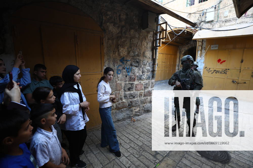Jewish Settlers Enter Hebron s Old City Under Israeli Army Protection Jewish settlers enter the Old City of Hebron in the West Bank under the protection of Israeli army forces, on October 10, 2026. Photo by Mamoun Wazwaz apaimages Hebron West Bank Palestinian Territory 101026_Hebron_MW_00(29)