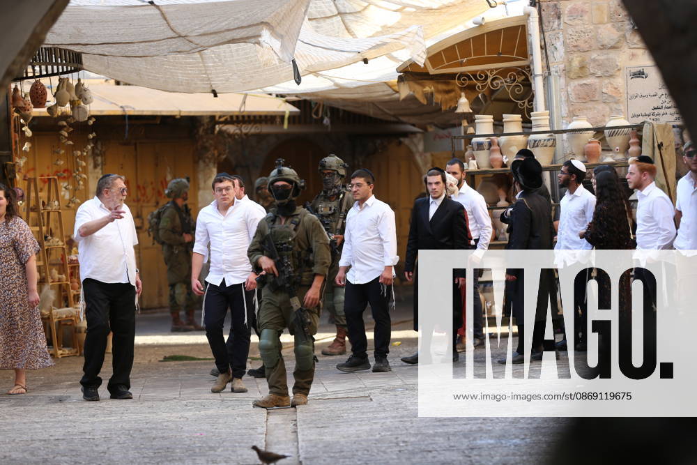 Jewish Settlers Enter Hebron s Old City Under Israeli Army Protection Jewish settlers enter the Old City of Hebron in the West Bank under the protection of Israeli army forces, on October 10, 2026. Photo by Mamoun Wazwaz apaimages Hebron West Bank Palestinian Territory 101026_Hebron_MW_00(7)