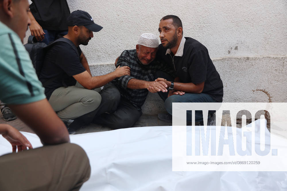 Palestinians Mourn Victims of Israeli Attack in Gaza City Palestinians mourn beside the bodies of their loved ones at al-Shifa Hospital in Gaza City, on October 10, 2026, after they were killed in an Israeli attack. The attack comes as the Israeli army continues its strikes across the Gaza Strip despite a ceasefire. Photo by Mohammed Salha apaimages Gaza Gaza Strip Palestinian Territory 101026_Gaza_MS_00(1)
