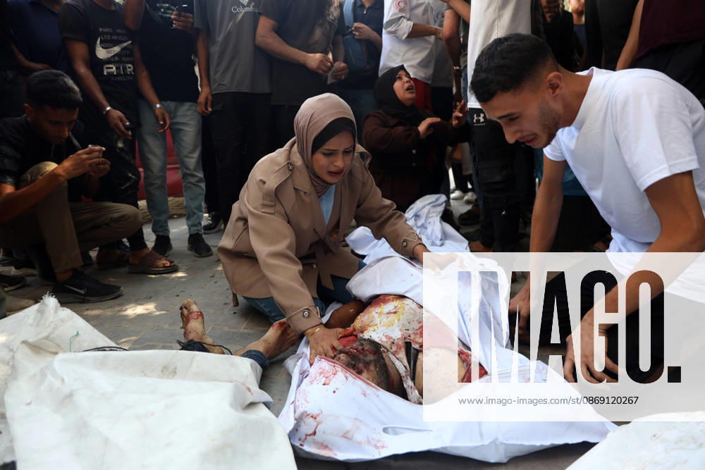 Palestinians Mourn Victims of Israeli Attack in Gaza City Palestinians mourn beside the bodies of their loved ones at al-Shifa Hospital in Gaza City, on October 10, 2026, after they were killed in an Israeli attack. The attack comes as the Israeli army continues its strikes across the Gaza Strip despite a ceasefire. Photo by Mohammed Salha apaimages Gaza Gaza Strip Palestinian Territory 101026_Gaza_MS_00(12)