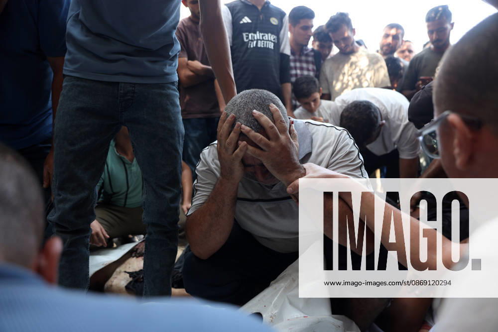 Palestinians Mourn Victims of Israeli Attack in Gaza City Palestinians mourn beside the bodies of their loved ones at al-Shifa Hospital in Gaza City, on October 10, 2026, after they were killed in an Israeli attack. The attack comes as the Israeli army continues its strikes across the Gaza Strip despite a ceasefire. Photo by Mohammed Salha apaimages Gaza Gaza Strip Palestinian Territory 101026_Gaza_MS_00(7)