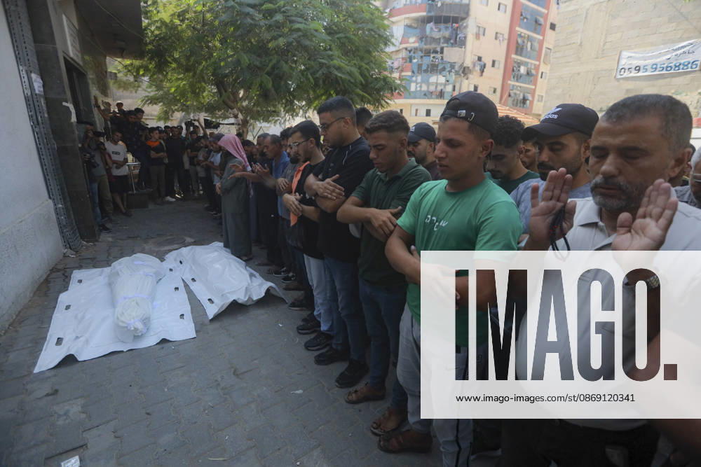 Gaza Palestine Airstrike Aftermath Mourners perform prayers a shrouded body outside Al-Shifa Hospital in Gaza City, Palestine on October 10, 2026. Four Palestinians were killed in an air strike near Panda Mall, and people carried the victims toward Al-Shifa Hospital for funeral prayers. Gaza Gaza Strip Palestinian Territories