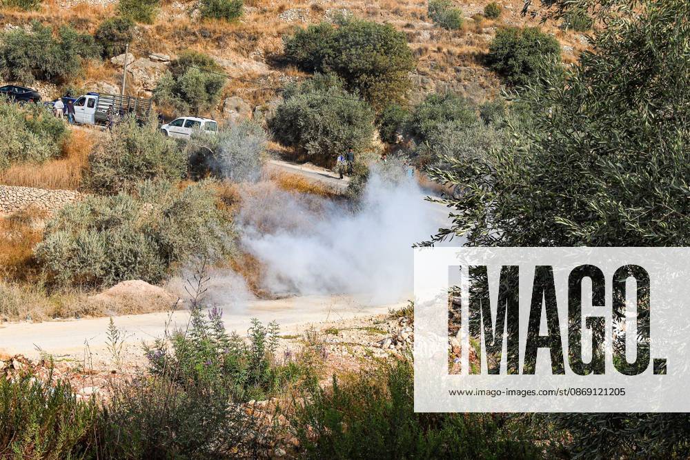 DEIR ABU MASHâ€⠢AL, PALESTINE †OCTOBER 10, 2026: Palestinian farmers came under attack by Israeli settlers and Israeli forces as they headed to harvest olives on their land in Deir Abu Mashâ€⠢al, northwest of Ramallah. The event marked the villageâ€⠢s first olive harvest gathering of the new season. The Palestine Red Crescent Society reported that its teams treated nine people injured during the incident. The injuries included one caused by live ammunition to the thigh, two caused by rubber-coated metal bullets, and six resulting from physical assault. One of those struck by a rubber-coated metal bullet was photojournalist Issam Al-Rimawi. The incident occurred during the annual olive harve - ZUMAq101 20261010_zna_q101_058